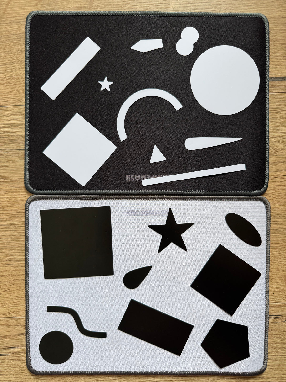 Both Shapemash canvases, black and white, with loose shapes laid out