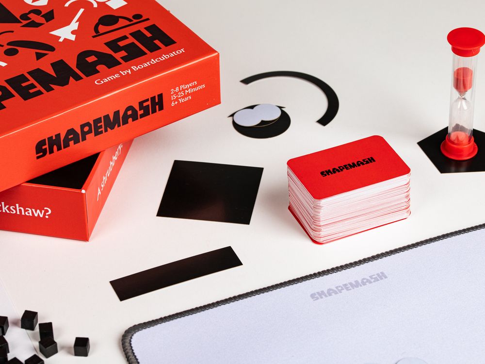 The Shapemash box with cards, shapes and the sand timer