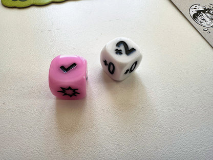 The custom race die and damage die from Kitchen Rally