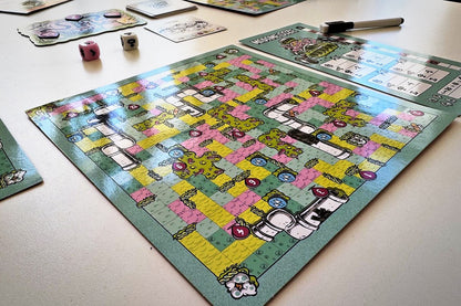 Kitchen Rally board, dry-erase marker and dice mid-game on a table