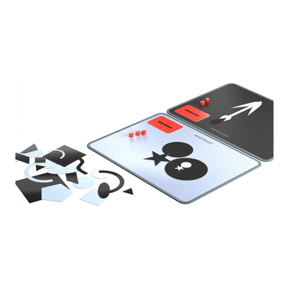 Shapemash in play: two canvases with pictures built from shapes, word cards and scoring cubes